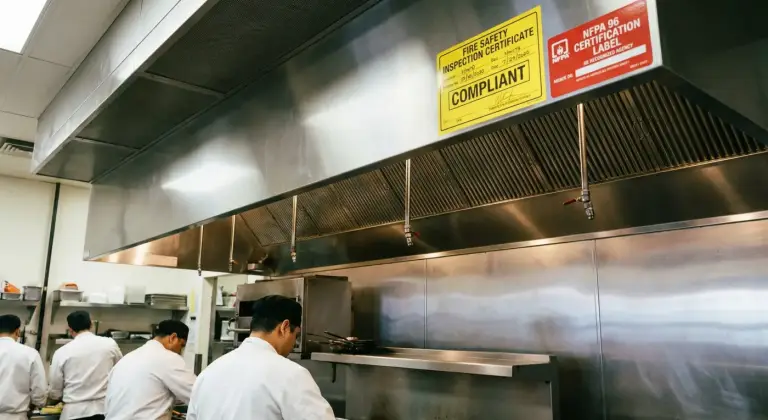 Service label on a commercial kitchen hood
